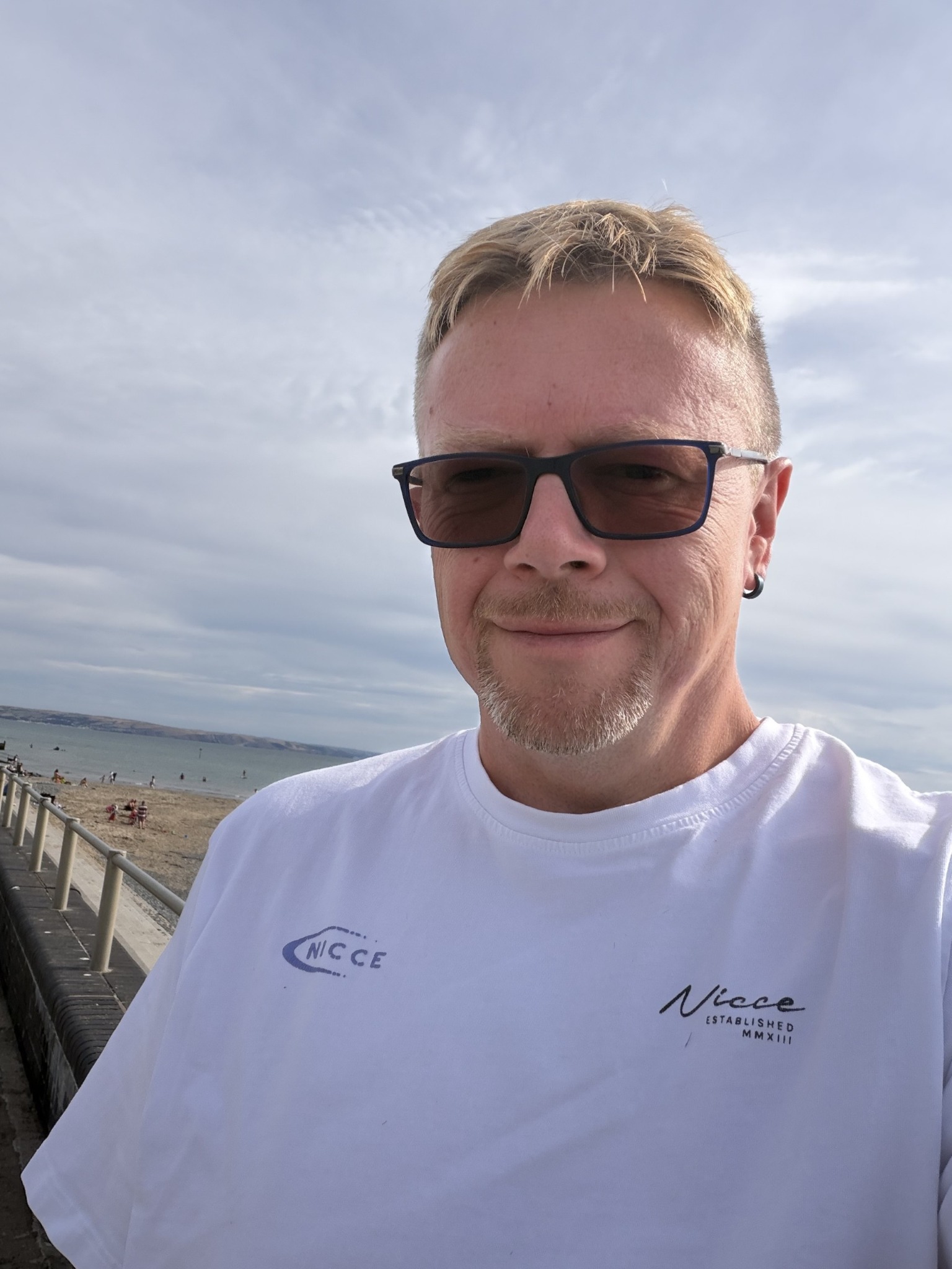 John smiling on the Welsh coast