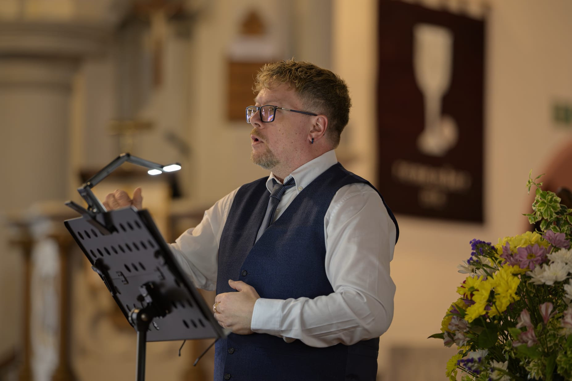 John conducting in formalwear